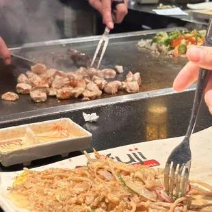 a person using a fork to eat