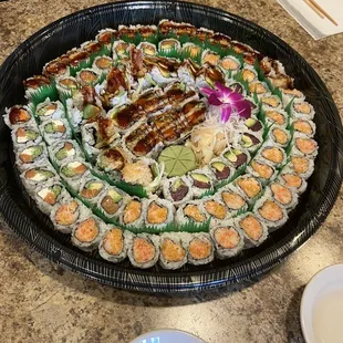 a large platter of sushi on a table