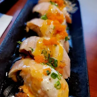 Simba nigiri-torched/seared salmon, sauces, masago &amp; green onion