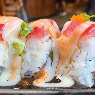 three pieces of sushi on a plate