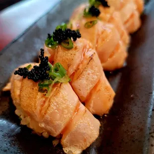 Salmon belly nigiri-torched/seared salmon belly, masago, green onion