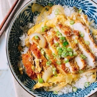 This is Pork Katsudon served over rice with a fried egg and sauce on top. They have no idea what it is. So don&apos;t order it here