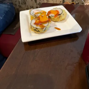 a plate of sushi on a table