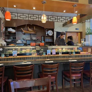 a sushi restaurant with a long counter