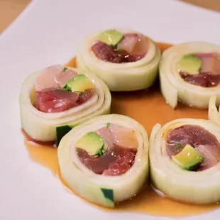 a plate of sushi rolls