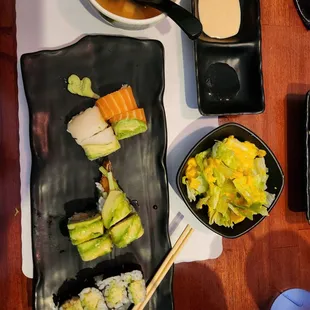 rainbow roll, green dragon roll, miso soup and ginger salad