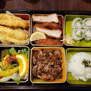 a bento box with a variety of food items