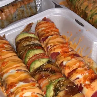 lion king (top left) sunset roll (top right)  silver phoenix, dragon, red dragon (left, middle, right)