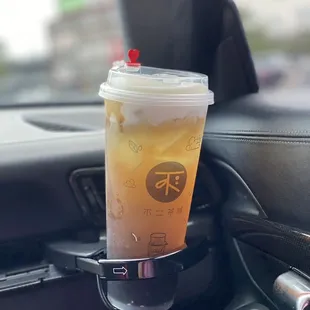 white peach tea with cheese foam and boba