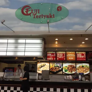 a man standing in front of a restaurant