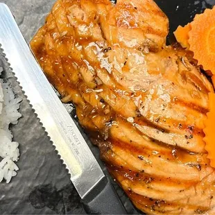 a plate of rice, carrots, and chicken