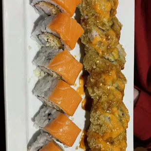 a plate of sushi and rolls