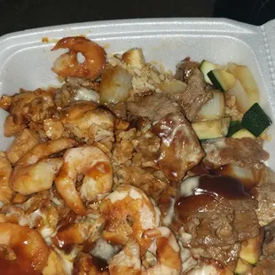My chicken, steak, and shrimp combo after I took several bites out of it. Large portions, for sure.