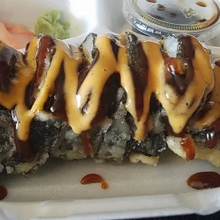 a close up of a roll with sauce