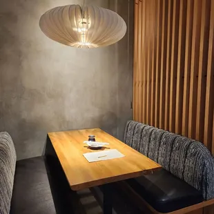 a wooden table and bench in a restaurant