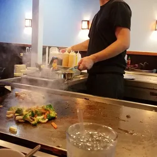 a man preparing food in a restaurant
