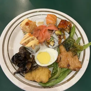First plate - sushi, egg, mushrooms, green beans. Solid