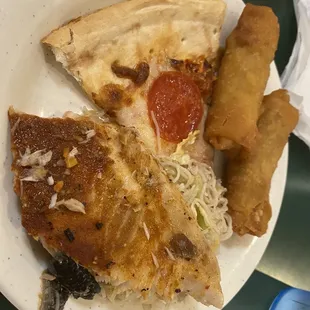 Greasy egg rolls, pale pizza. Untouched.