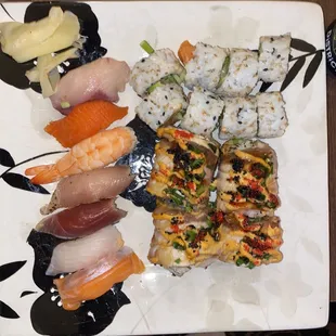 Sushi combo: 7 pcs nigiri and a salmon roll, + hamachi king roll (bottom right)