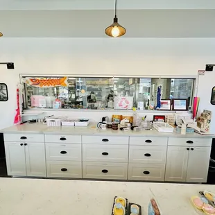 View of front counter and kitchen in the back
