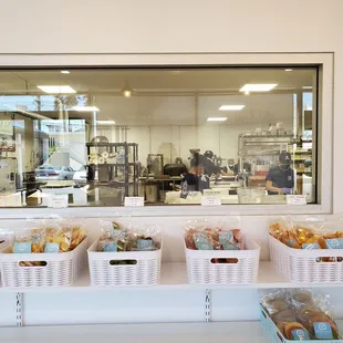 You can see the staff making mochi and packaging snacks.