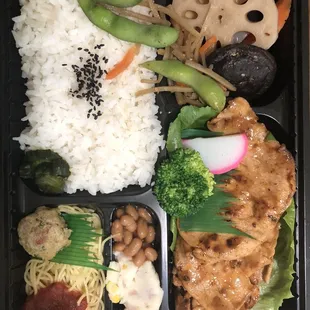 a bento box of food
