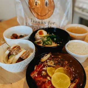 bowls of ramen and a bag of rice
