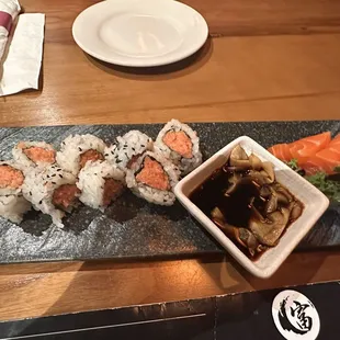 Spicy tuna roll and salmon sashimi