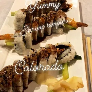 a plate of sushi and a glass of water