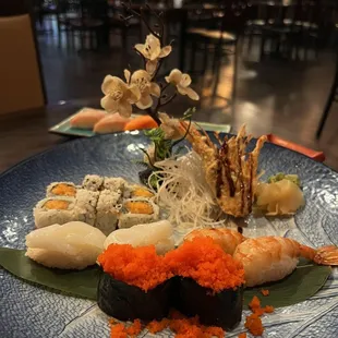 a plate of sushi and shrimp