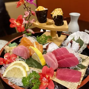 Spicy Scallop hand rolls, tuna, yellowtail, salmon, octopus sashimi