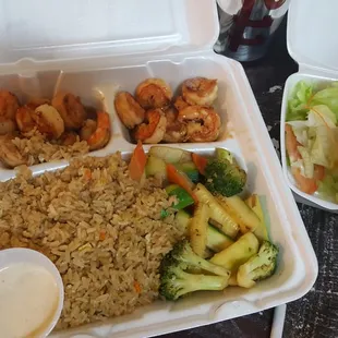 two take out containers of food