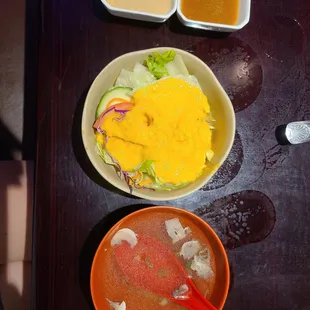 Ginger dressing salad and clear soup