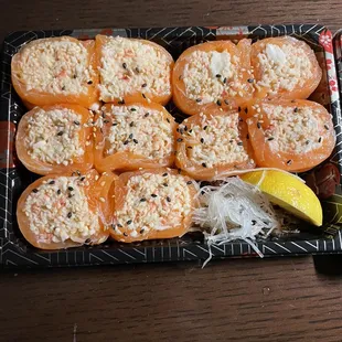 Fresh salmon wrapped around a spicy imitation crab mix.