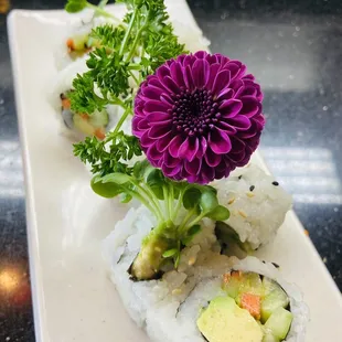 Veggie roll with purple flower to match my attire... how sweet