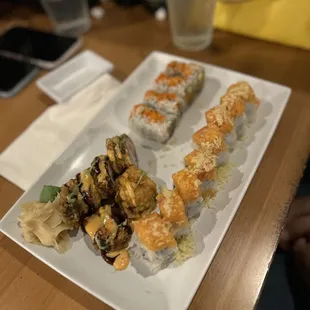 a plate of sushi and a glass of water