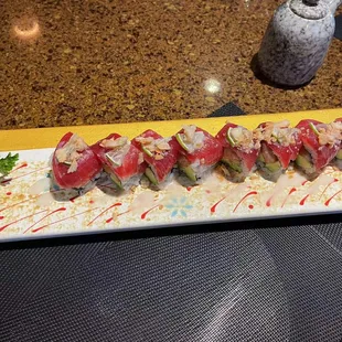 # 1 ,MAR ZOOKI Maki .
 inside salmon top tuna
 lime  mango scallion fried lotus
 coconut sauce