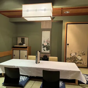 a dining room with a table and chairs