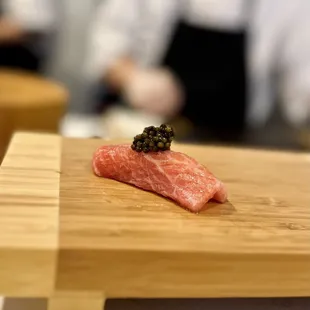 a piece of salmon on a cutting board