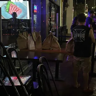 TO GO Orders kept OUTSIDE on a Tucson summer night (it's a heat wave rn).