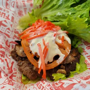 Kinoko burger, protein style added tomato and pickled cucumbers