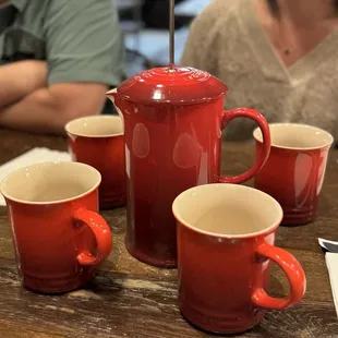 Pot of hot tea (in a Le Creuset pot press)