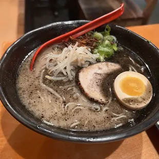 a bowl of ramen with a hard boiled egg