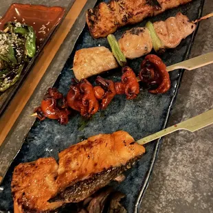 King salmon, baby octopus, chicken thigh, and miso glazed pork belly