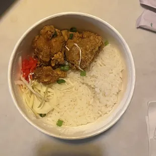 a bowl of rice and chicken
