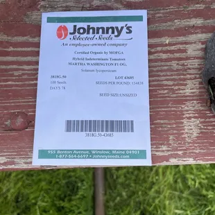 a close up of a label on a bench