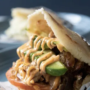 Arepa Pernil

pork, Avocado slice, tomatoes and spice mayo