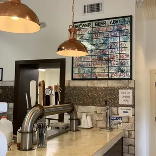 a counter with a menu on the wall