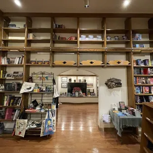 Through the doorway directly ahead is another room full of books  and places to sit.