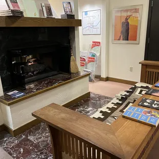 Just a wooden bench with a blanket on it, but in front of the fireplace it's comfortable and cozy